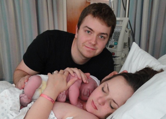 Michelle holding her new son after natural birth